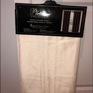 One pair of cream curtains.